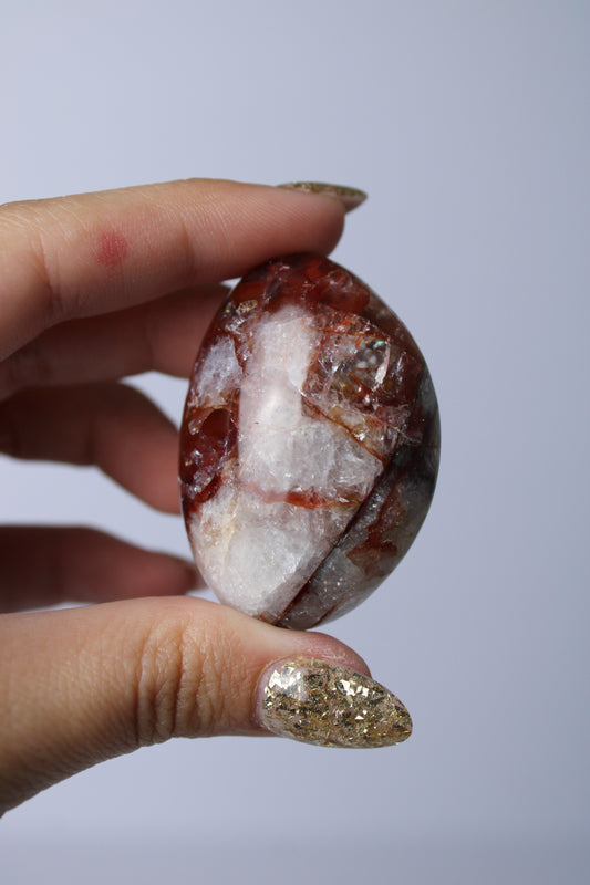 Fire quartz palmsteen - Gemstone Dreams