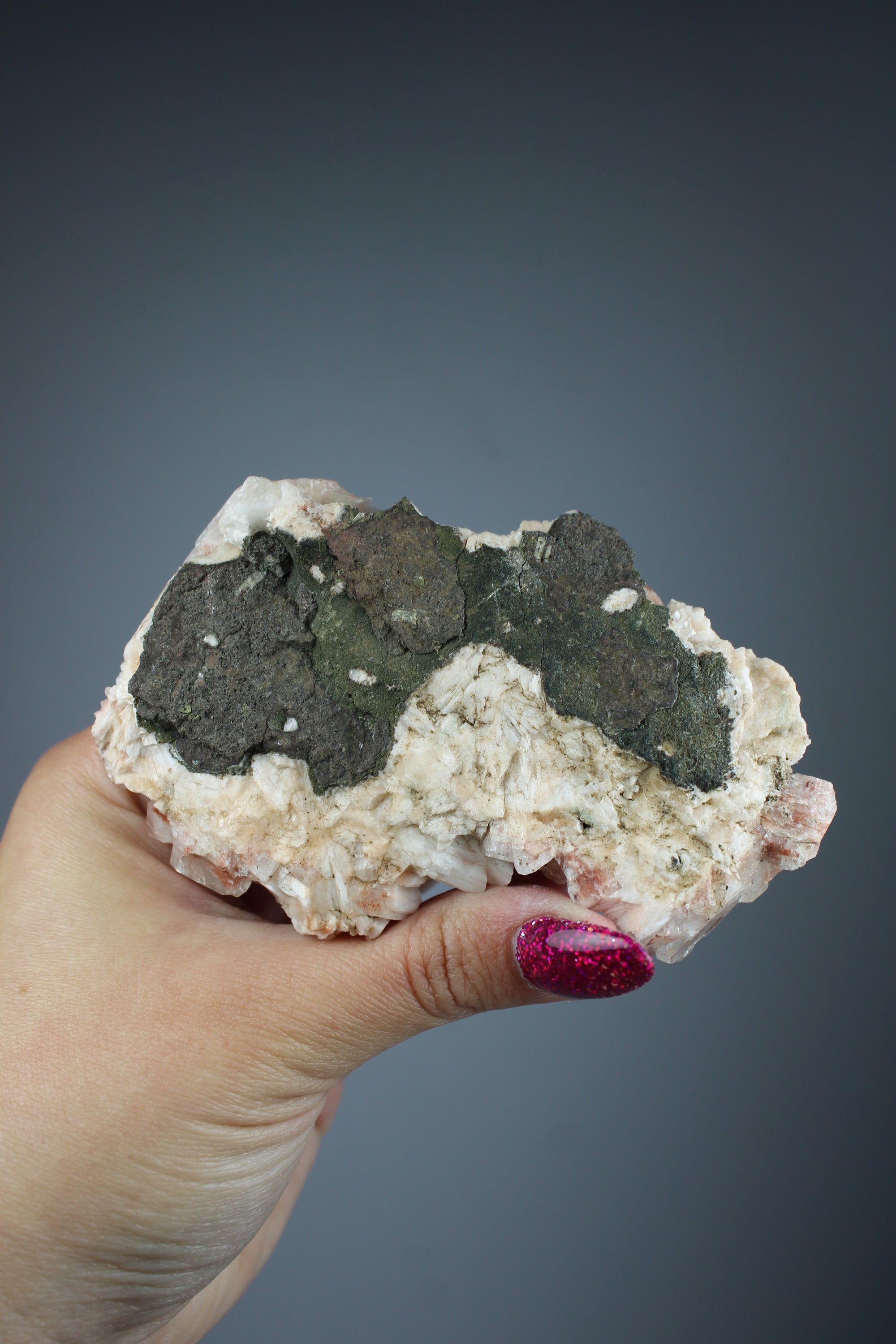 Hematiode quartz cluster with calcite
