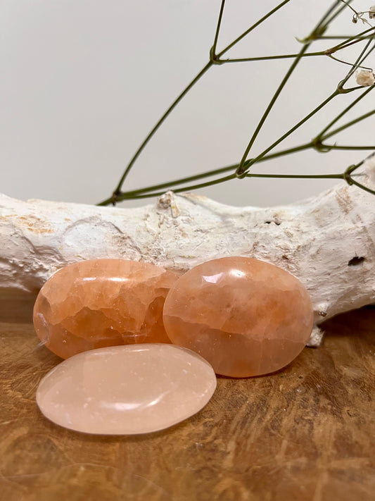 Orange selenite palm stone